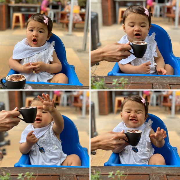 Baby trying her first babychino in Melbourne, Australia