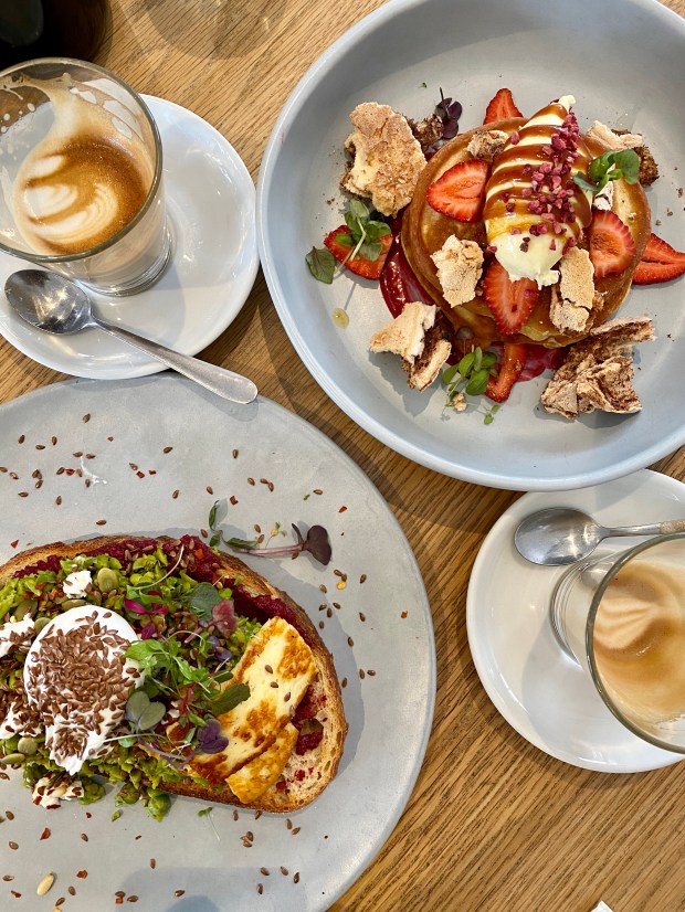 Decadent hotcakes and smashed avo at Clubouse in Malvern, VIC