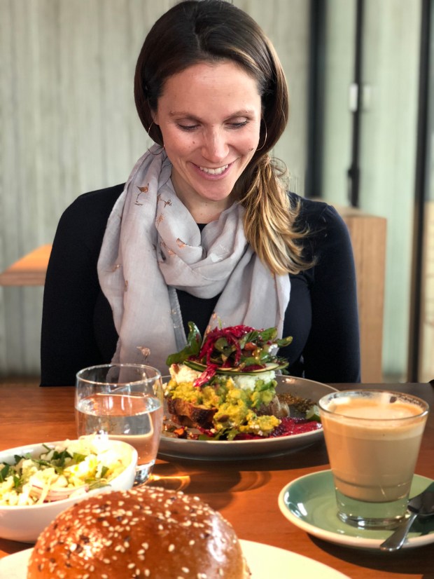 Woman at brunch at Plain Sailing in Elwood, VIC in Melbourne, Australia