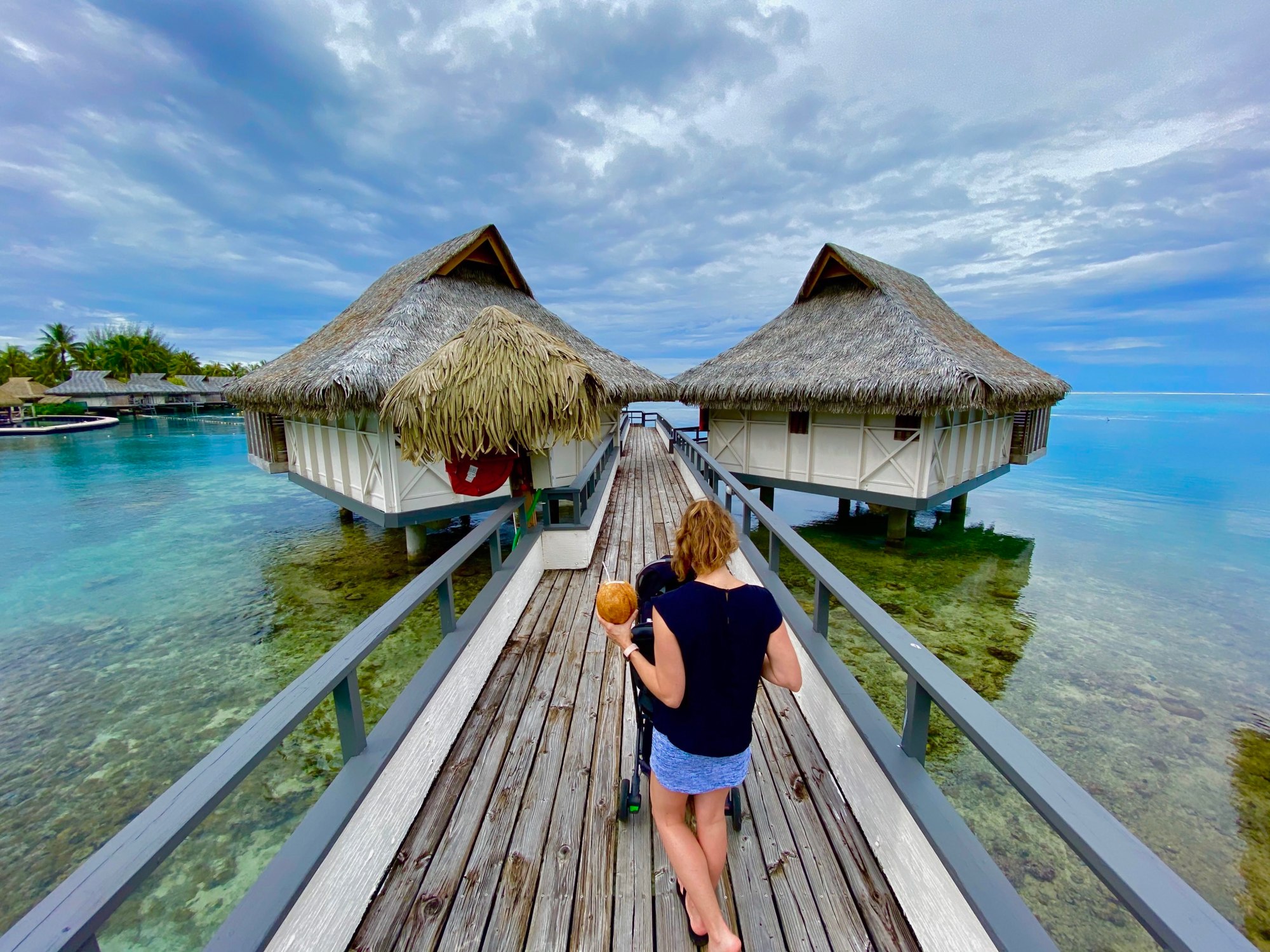 Walking out to an overwater bungalow in Moorea, French Polynesia