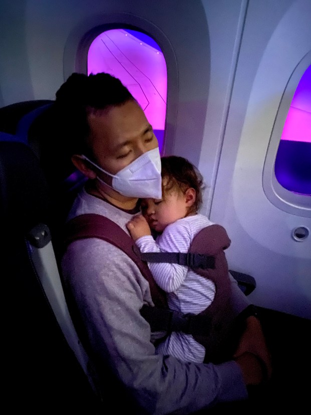 Sleeping with a baby in a carrier on an airplane